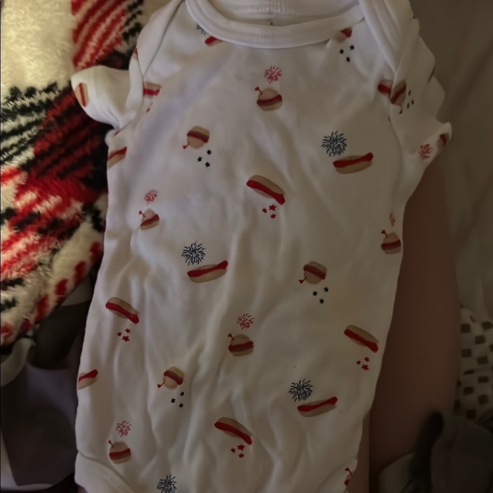 Festive White Baby Onesie with Red and Blue Accents